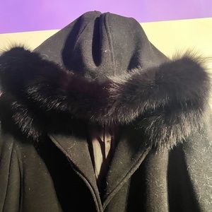 Marvin Richard’s long coat with fox fur cuffs and hood